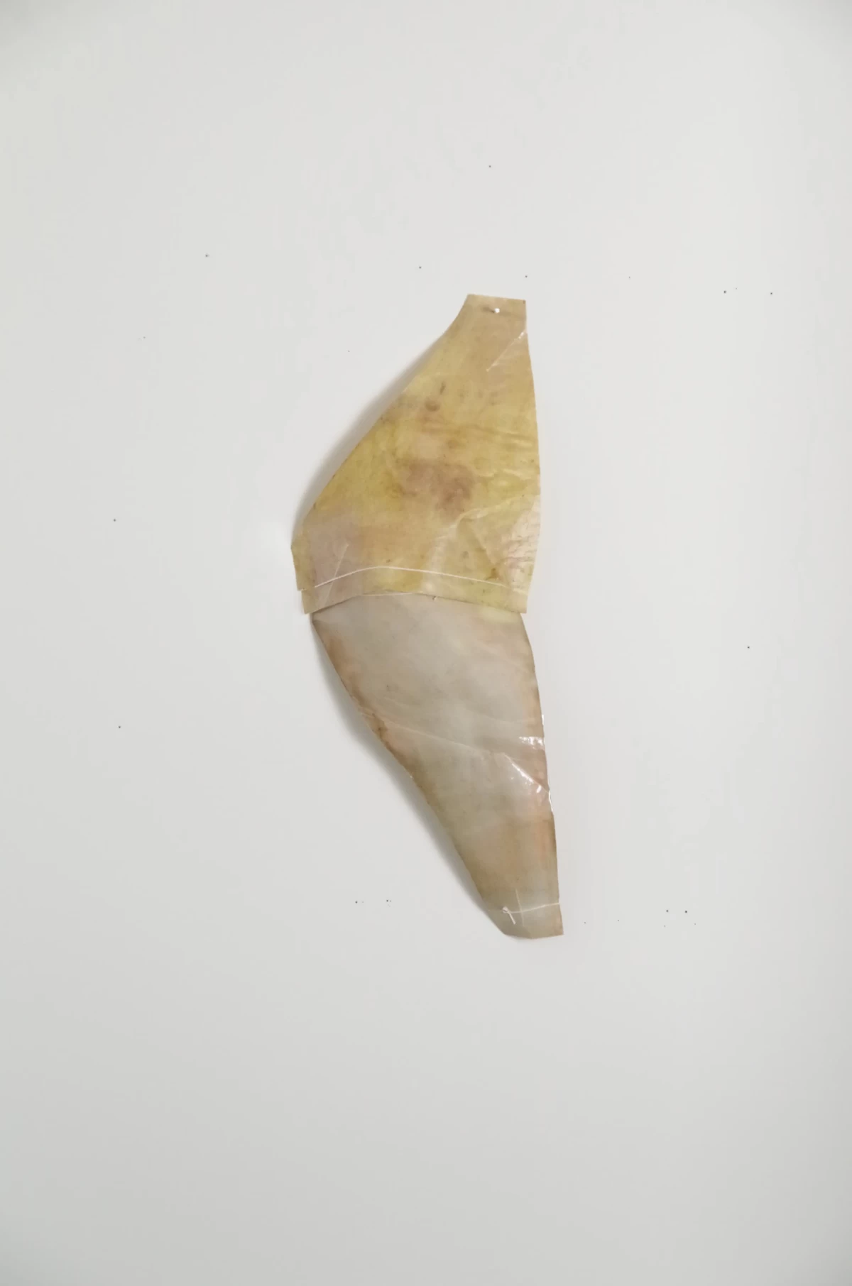 a shape [14/24/5 cm] textile remnants stiffened with flour paste - colored with self-produced pigments - zoe bilgeri/ 2024/ weimar